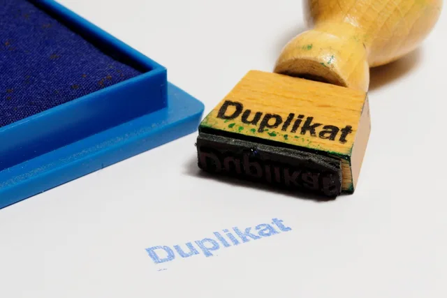 rubber stamp, wooden stamp, duplicate, ink pad, office, paper, duplicate, duplicate, duplicate, duplicate, duplicate. Deduplicating repeated form submissions