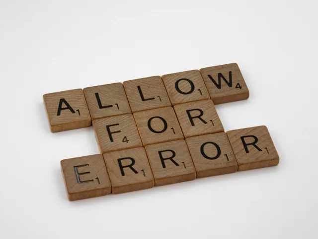 Wooden Scrabble tiles spelling 'Allow for Error' on a white surface. Making error messages useful during form completion