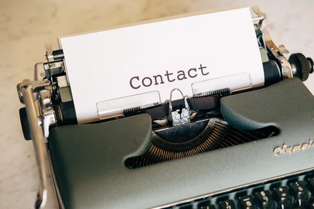 Close-up shot of a vintage typewriter with a contact sheet. Perfect for retro themes. Preventing duplicate contact from several salespeople